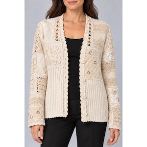 May include: A cream-colored long-sleeve cardigan featuring a patchwork design of various textures including quilted fabric, ribbed knit, and intricate lace panels. The garment has a scalloped edge trim and is fastened with four round buttons.