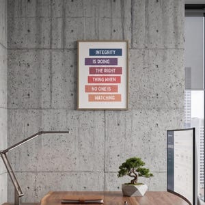 print with the text "INTEGRITY IS DOING THE RIGHT THING WHEN NO ONE IS WATCHING" . The print has colorful text blocks.