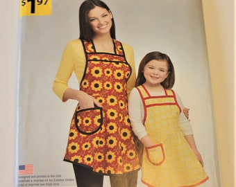 Simplicity 1056: Child's and Misses' Aprons Sizes S-L UNCUT