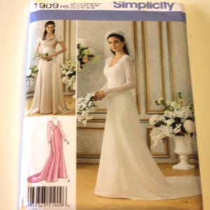 May include: Simplicity sewing pattern 1909 HS featuring images of elegant wedding dresses. The cover showcases a bride in a white gown with lace sleeves and a long train, and another in a champagne-colored dress.