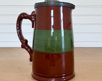 Vintage green and brown syrup pitcher with pewter lid