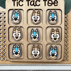 blue dog cartoon character hand painted maple wood tic tac toe board each board measures 6 inches pieces measure 1.4 inches
