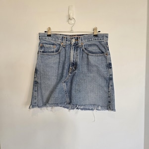 Vintage 1990s Y2K high-waist Levi&#39;s 369 loose straight denim cut-off mini skirt. Vintage Clothing by VintageTwists.