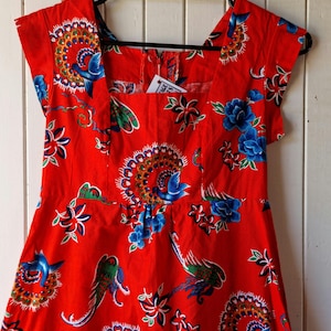 Vintage 1960s red and blue fit and flare tiki dress. Vintage Clothing by VintageTwists.