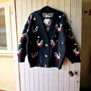 1980 年代のヴィンテージ ユニセックス アグリー クリスマス カーディガン。VintageTwists のヴィンテージ クロージング。
