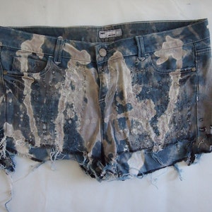 Vintage 1990s Y2K blue cut-off destroyed denim shorts. Vintage Clothing by VintageTwists.