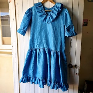 Vintage aqua blue 1980s prom dress with ruffle hem and neckline. Vintage Clothing by VintageTwists.