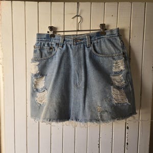 Vintage 1990s Y2K high-waist distressed Levi&#39;s denim skirt. Vintage Clothing by VintageTwists.