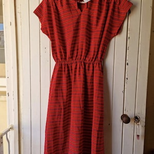 Vintage 1980s red retro secretary midi dress with horizontal pinstripes in yellow, black, and grey. Vintage Clothing by VintageTwists