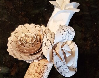 men's book page paper flower boutonniere on wine cork with mini rose and  bud and spiral rose