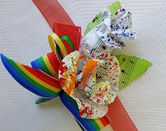 rainbow paint splattered music page wrist corsage brooch wedding accessory recycled vintage hymnal