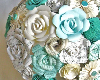 the Cara in teal and aqua turquoise with book page roses and hymnal sheet music flowers and spirals roses alternative brides bouquet