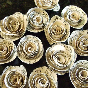 Dozen  1. 25&quot;-1.75&quot;    hymnal sheet music page spiral roses embellishments recycled vintage books