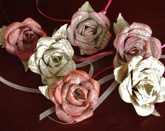 mixed bouquet of paper roses recycled Bible and sheet music hymnal books tinted red for Christmas wedding decor