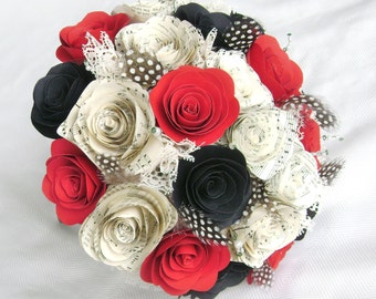 Wedding bouquet with red black and sheet music spiral roses cabbage paper flowers with feathers and lace alternative