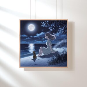 May include: A framed print shows a tranquil night scene. A person in a light green dress sits on a grassy dune, looking at the moonlit ocean. A tabby cat sits close by. The sky is a deep blue, with a full moon and clouds.