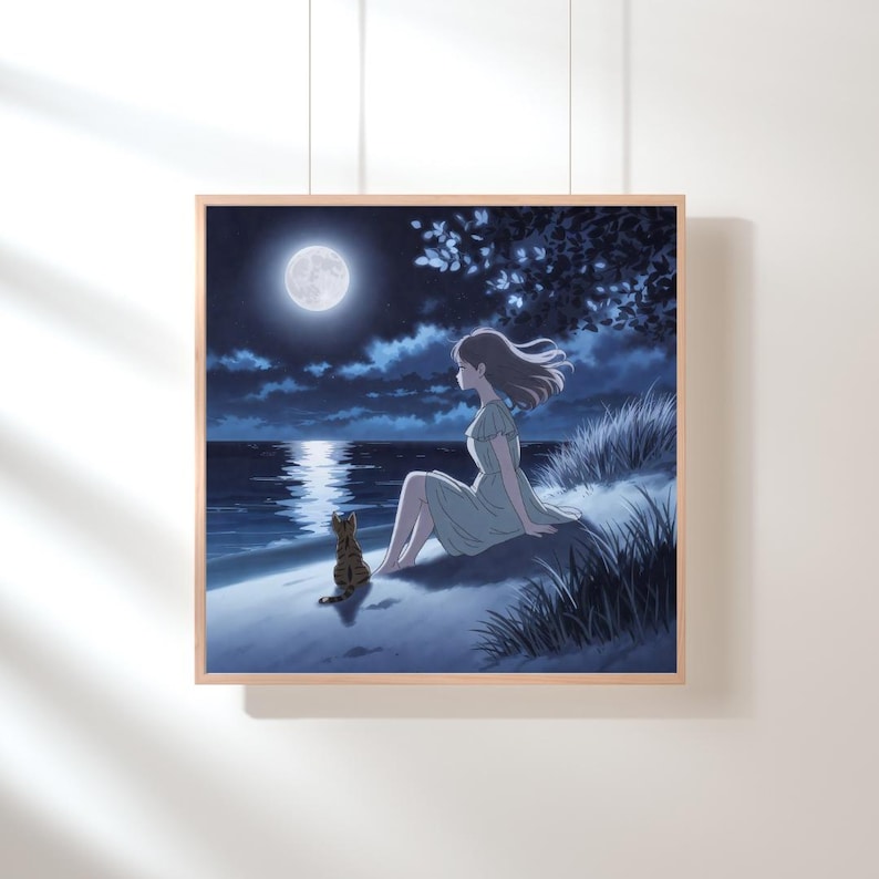May include: A framed print shows a tranquil night scene. A person in a light green dress sits on a grassy dune, looking at the moonlit ocean. A tabby cat sits close by. The sky is a deep blue, with a full moon and clouds.