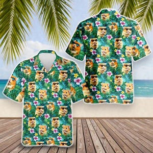 May include: A short-sleeved Hawaiian shirt featuring a repeating pattern of hamsters wearing sunglasses, set against a backdrop of tropical foliage and flowers. The shirt has a classic collar and button-down front, with a vibrant, colorful design.