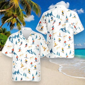 May include: White button-down shirt with a ski-themed pattern. The shirt features skiers in various colored outfits, blue trees, and mountain illustrations. The shirt is short-sleeved and has a relaxed fit, perfect for a casual look.