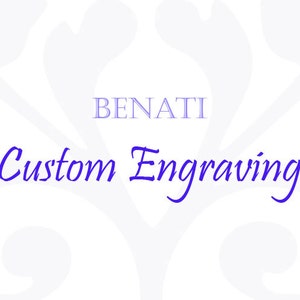 May include: A white background with a floral design in a light gray color. The text "BENATI Custom Engraving" is in blue.