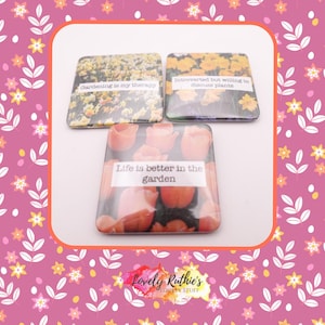 May include: Set of three square coasters with floral designs and text. One coaster says "Gardening is my therapy," another says "Introverted but willing to discuss plants," and the third says "Life is better in the garden."