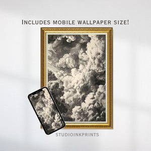 May include: A framed black and white print of a cloudscape, with a gold-colored ornate frame. A smartphone displays the same cloudscape image. The text "INCLUDES MOBILE WALLPAPER SIZE!" is at the top. The text "STUDIOINKPRINTS" is at the bottom.