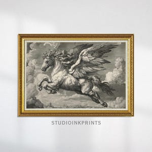 May include: A framed black and white print of a winged horse, Pegasus, soaring through the clouds. The artwork is in a gold ornate frame. The print has a vintage aesthetic. The text "STUDIOINKPRINTS" is at the bottom.