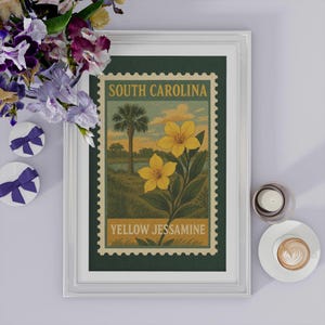 May include: Framed print of a vintage South Carolina postage stamp design. The artwork features a palm tree, yellow Jessamine flowers, and the text "South Carolina" and "Yellow Jessamine". The print is in a white frame.