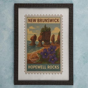 May include: Framed print of a vintage postage stamp design featuring Hopewell Rocks in New Brunswick, Canada. The stamp art depicts the iconic rock formations, ocean, and purple flowers. The frame is dark brown.