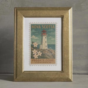 May include: A framed print depicting a lighthouse on a stamp. The image shows a white lighthouse with a red top, set against a blue sea and sky. The frame is gold-coloured.