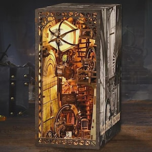 May include: A detailed wooden box with a steampunk theme. The interior is illuminated, showcasing gears, a chair, and a light. One side of the box features a black and white architectural design.