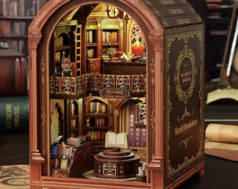 May include: A miniature wooden bookstore model with intricate details, including shelves filled with tiny books, a reading area, and warm interior lighting. The exterior features arched design and the text "World Bookstore".