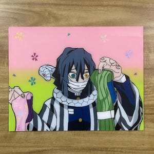 May include: Anime-style artwork featuring a character with blue hair, a snake-like accessory, and a striped outfit. The background transitions from green to pink, adorned with floral accents. The character is holding a green and white object.