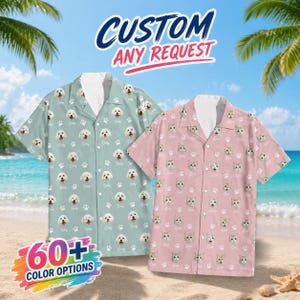 May include: Two short-sleeved button-down shirts with custom pet face patterns. One shirt is light blue with dog faces and paw prints, the other is pink with cat faces and paw prints. The image includes the text "CUSTOM ANY REQUEST" and "60+ COLOUR OPTIONS".