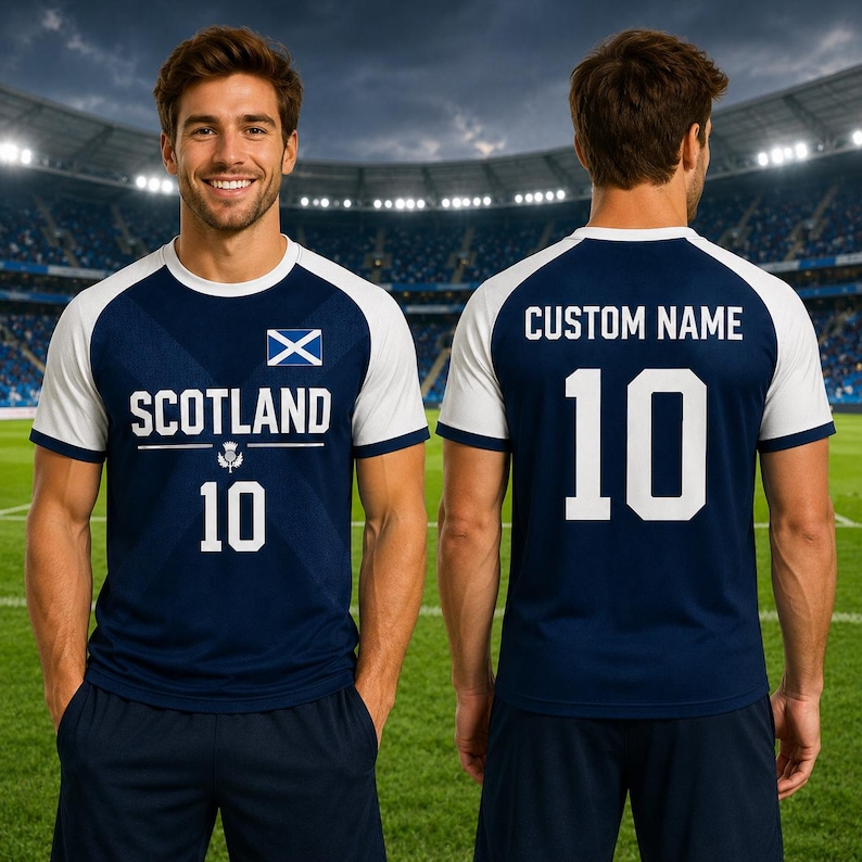 May include: Navy blue and white soccer jersey with the word "SCOTLAND" and the number "10" printed on the front. The jersey features the Scottish flag and a thistle emblem. The back of the jersey has the number "10" and space for a custom name.