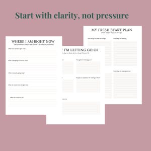 May include: Three white paper planners with text, including "Start with clarity, not pressure" and "My Fresh Start Plan." The planners have prompts for self-reflection and goal setting, with lined spaces for writing.