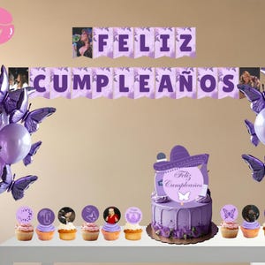 May include: A purple birthday party scene with a cake, cupcakes, balloons, and banners. The cake is decorated with a sombrero and the words "Feliz Cumpleaños". Butterfly decorations and toppers add to the festive theme.