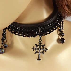 Black cross collar. Bdsm slave collar with black cross, black chains and black glass beads. Silver buckle keeper and dee.