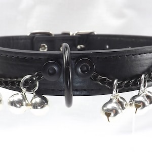 Jingle bells collar with black front dee ring. Black chains and silver bells black leather collar. Bdsm slave bell collar.