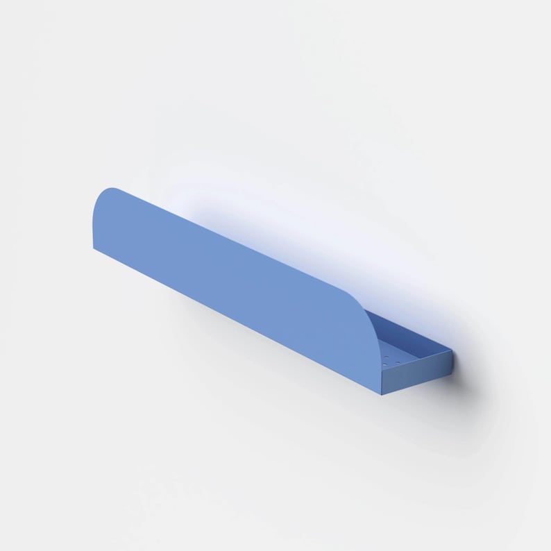May include: A light blue wall-mounted shelf with a long, horizontal rectangular base and a curved front edge. The shelf features a flat surface with small, evenly spaced circular perforations along the bottom for drainage or ventilation.