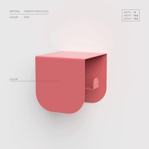 May include: A rose-colored, powder-coated steel wall shelf. The shelf has a depth of 12, width of 13.6, and height of 13.6. The design features a curved front and a small shelf inside.