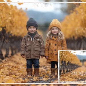 May include: Two children wearing fall-themed clothing stand in a path lined with yellow autumn leaves. The girl is wearing a yellow knit hat and a brown coat. The boy is wearing a gray knit hat and a brown jacket.