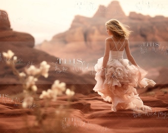 May include: A young girl in a white and pink ruffled dress stands in a desert landscape with red rock formations in the background. The girl is looking away from the camera and her hair is blowing in the wind.