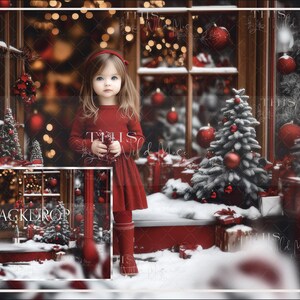 May include: A young girl in a red dress stands in front of a Christmas-themed backdrop. The backdrop features a red storefront with a window display of Christmas ornaments and a snowy, frosted Christmas tree.