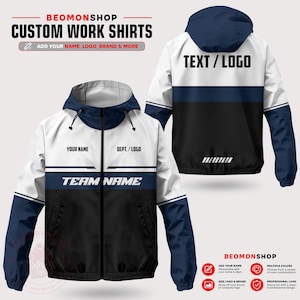 May include: A hooded zip-up jacket featuring a colour-blocked design in white, navy blue, and black. The front displays placeholders for YOUR NAME, DEPT. / LOGO, and TEAM NAME. The back includes a hood and a TEXT / LOGO placeholder area.
