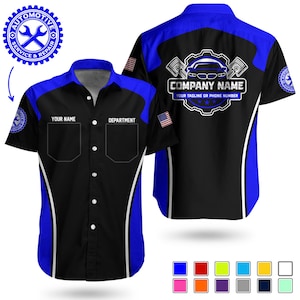 May include: Black and blue mechanic shirt with a button-down front. The shirt features a blue collar and shoulder accents, with the text "YOUR NAME" and "DEPARTMENT" above the pockets. The back of the shirt has a car graphic and the text "COMPANY NAME".