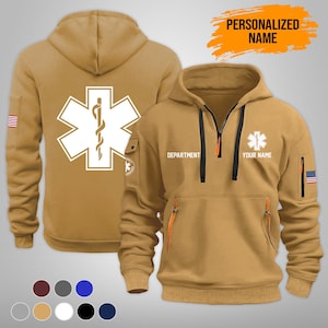 Puede incluir: Dos sudaderas con capucha de color canela con un s&iacute;mbolo m&eacute;dico. Una muestra la espalda con un gran s&iacute;mbolo blanco de la estrella de la vida. La otra muestra el frente con cremallera, bolsillos y el texto "DEPARTMENT" y "YOUR NAME". Ambas tienen un parche de la bandera estadounidense.