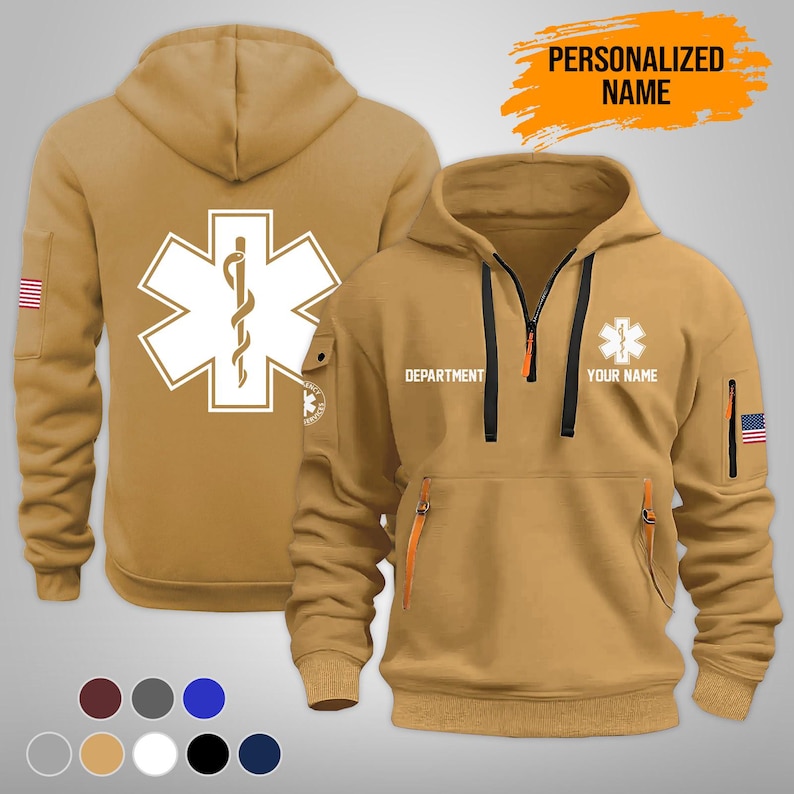 Puede incluir: Dos sudaderas con capucha de color canela con un s&iacute;mbolo m&eacute;dico. Una muestra la espalda con un gran s&iacute;mbolo blanco de la estrella de la vida. La otra muestra el frente con cremallera, bolsillos y el texto "DEPARTMENT" y "YOUR NAME". Ambas tienen un parche de la bandera estadounidense.