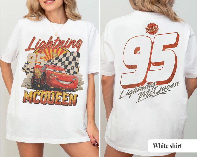 May include: A white t-shirt featuring a graphic of a red race car with the text Lightning McQueen and 95 on the front. The back of the shirt displays a large number 95 in white with a red outline, the text Lightning McQueen, and a Rust-eze logo.