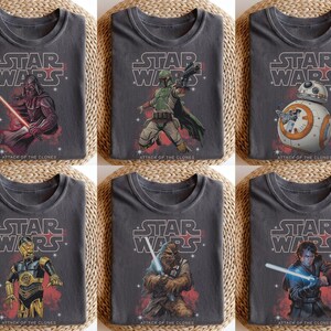 May include: Six gray t-shirts featuring Star Wars characters. Each shirt has the Star Wars logo and the text "Attack of the Clones." The characters include Darth Vader, Boba Fett, BB-8, C-3PO, Chewbacca, and Anakin Skywalker.